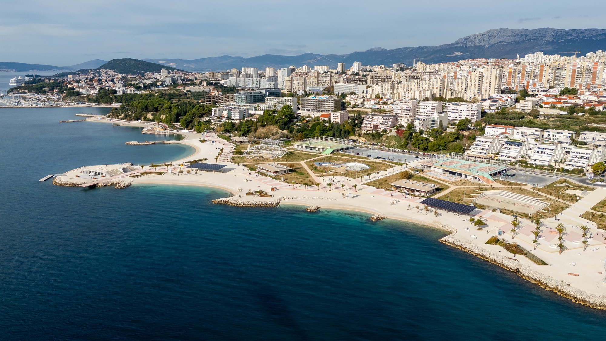Aerial view of Žnjan beach — white pebble bays, clear Adriatic water and Split’s coastline